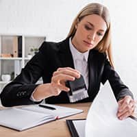 Woman stamping a document