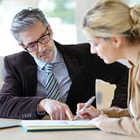 Man and woman reviewing a contract